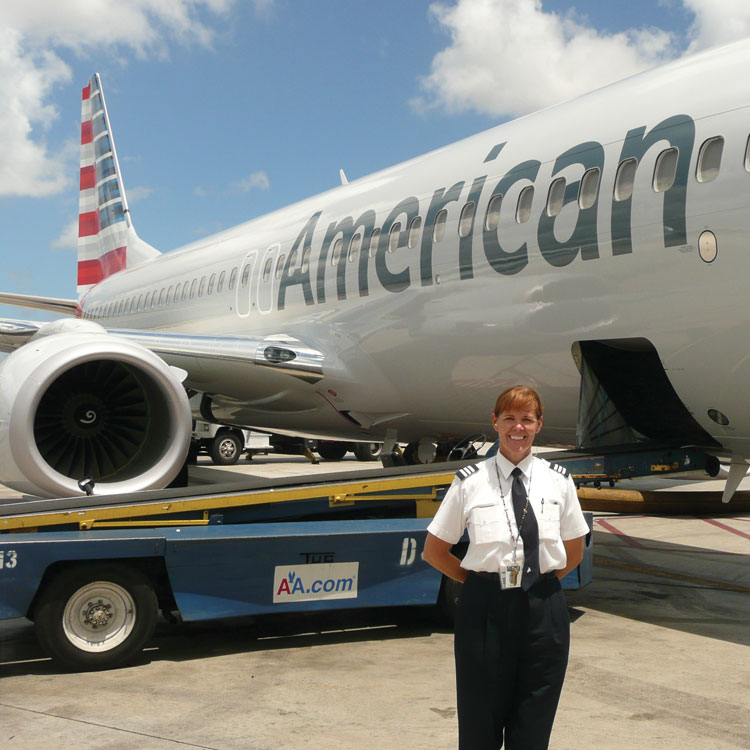 Donna Miller in front of plane