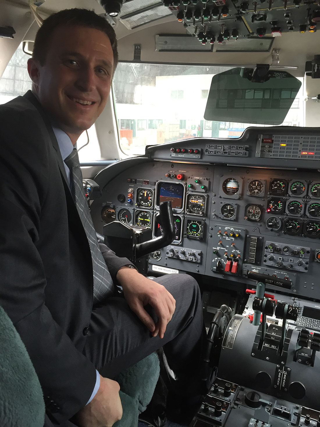 Aaron Mangone in a plane cockpit.