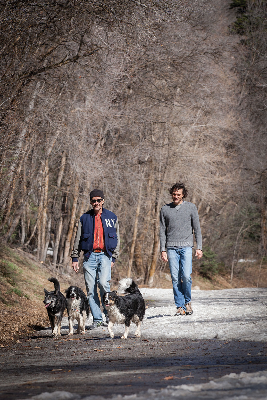 Dr. Brent Olson and Dr. Jeff Nichols with dogs