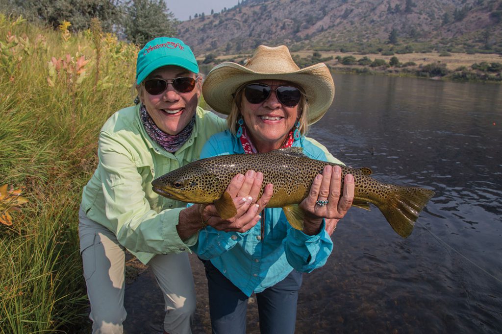 Maurrie Sussman and her sister, Rebecca Clarke, proudly show off their catch while fishing the mighty Missouri. 