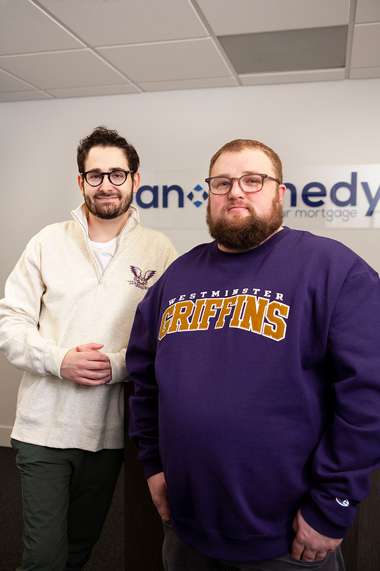 Zach Coombs and Chris Chytraus posing in Loan Remedy office
