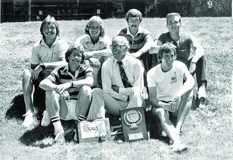 black and white photo of old tennis team and coaching staff